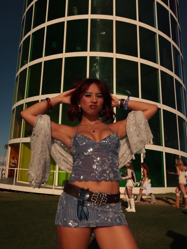 Arms up under the festival tower