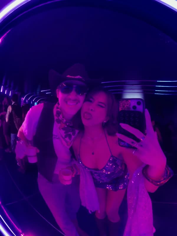 Mirror selfie under the purple lights