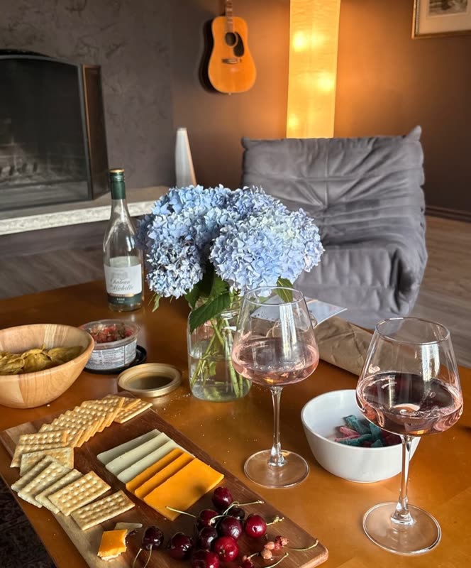 Wine, hydrangeas and a board on the table