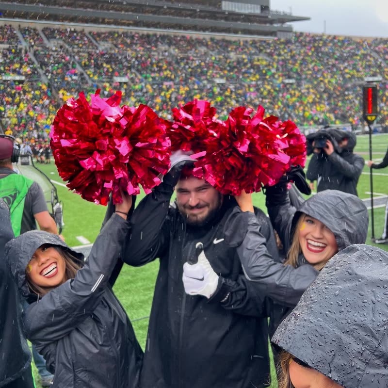 Poms up with the squad after a wet game